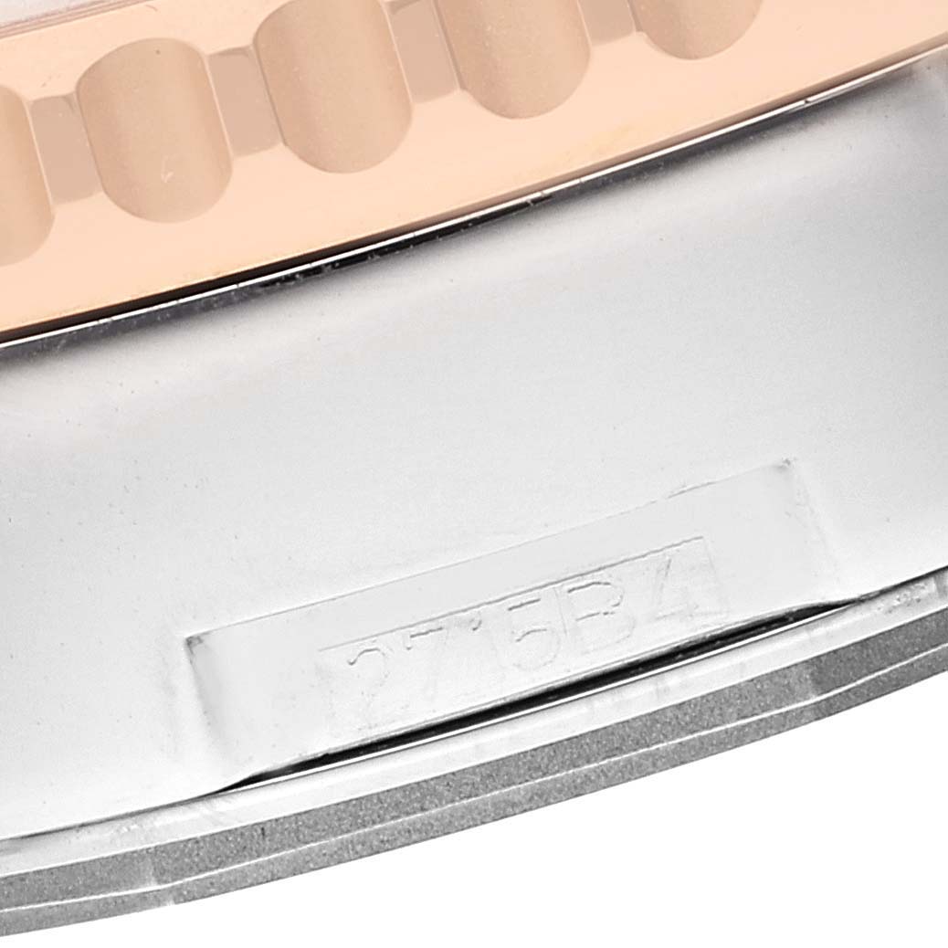 This close-up image shows the side of the bezel and part of the case of a Breitling Navitimer UB0127 Men's Steel and Gold (two tone) Black Dial UB0127 Men's Steel and Gold (two tone) Black Dial watch.