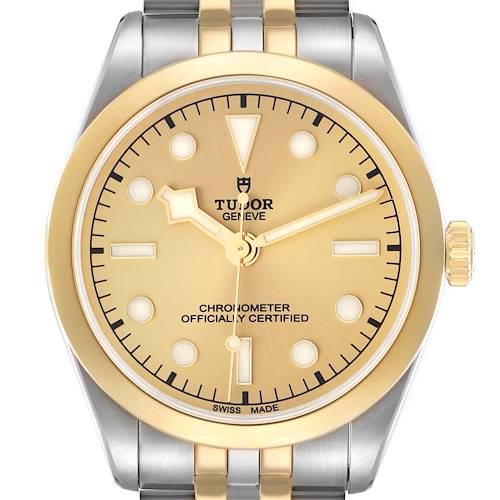 The Tudor Heritage Black Bay M79643-0005 Men's Steel and Gold (two tone) Champagne Dial watch is shown from a front angle, highlighting its gold and silver dial, markers, and bezel.