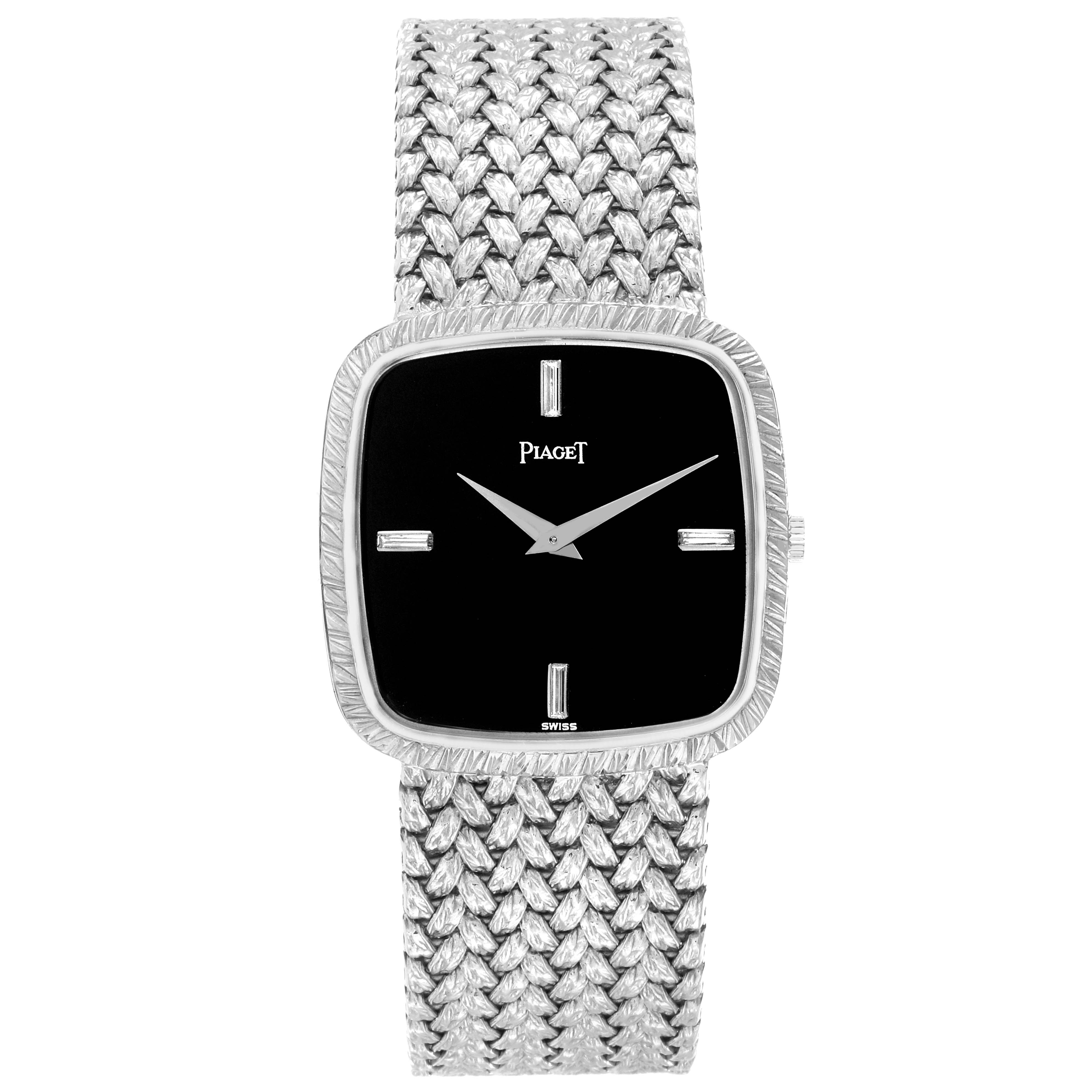 The image shows a frontal view of the Piaget Men's watch model 9771D2, highlighting its square face, intricate band, and minimalist dial design.