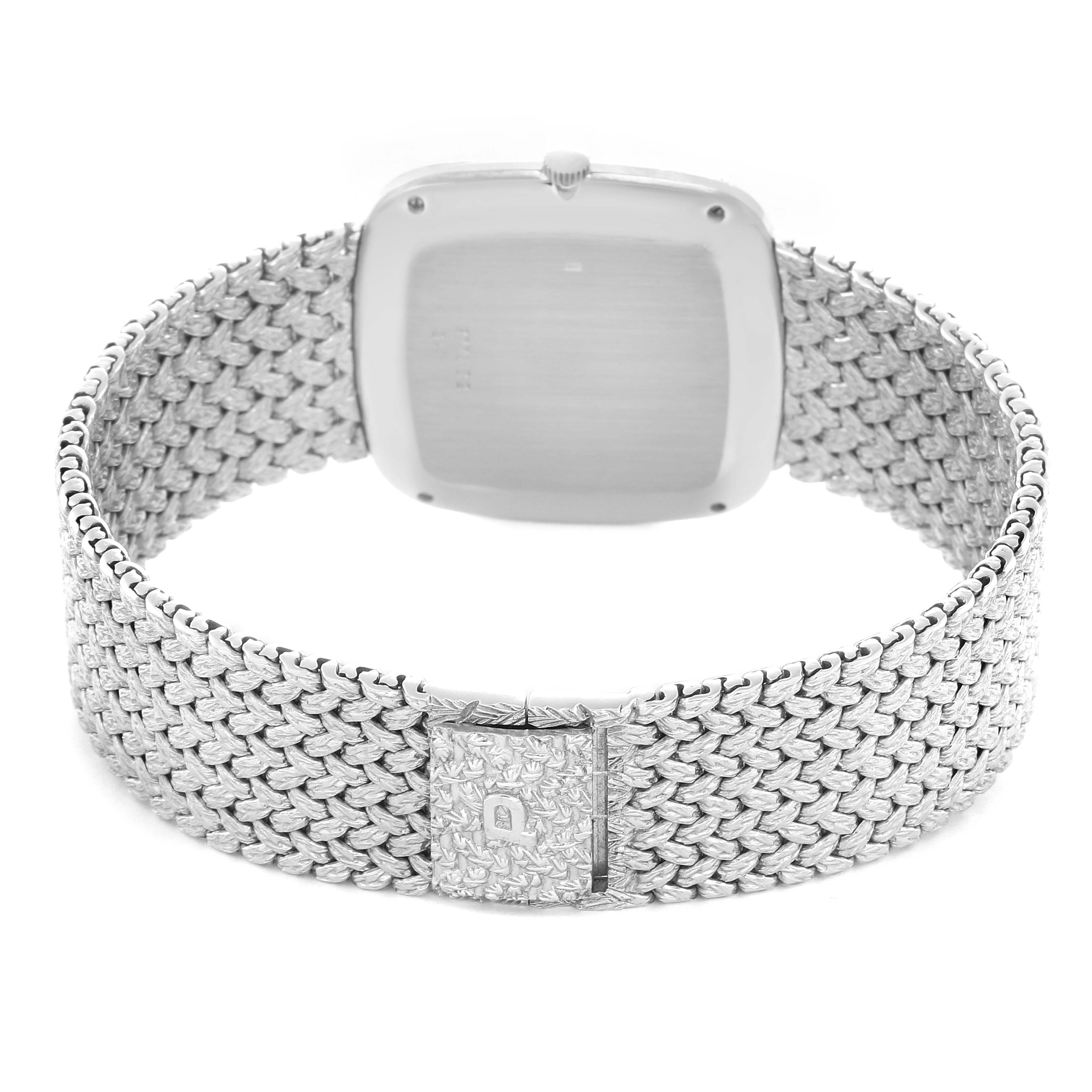 The image shows the back of the Piaget Men's watch model 9771D2, highlighting the clasp and textured bracelet from a rear angle.