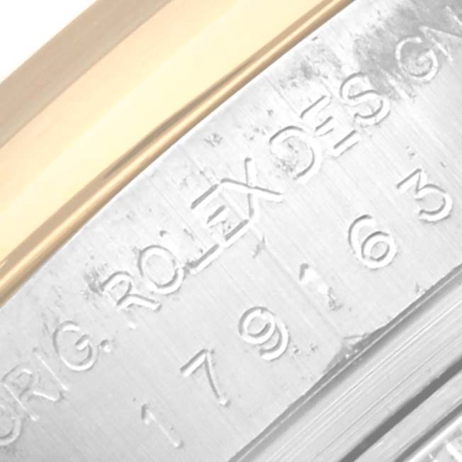 This close-up angle shows the engraved serial number and "ROLEX" text on the case of a Rolex Datejust 179163 Women's Steel and Gold (two tone) White Dial 179163 Women's Steel and Gold (two tone) White Dial model.