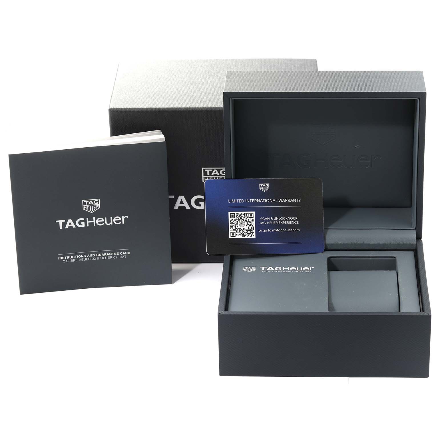 The image shows the packaging and accessories for a Tag Heuer Carrera CBS2216 Men's Stainless Steel Silver Dial CBS2216 Men's Stainless Steel Silver Dial model, including the box, warranty card, and instruction booklet.