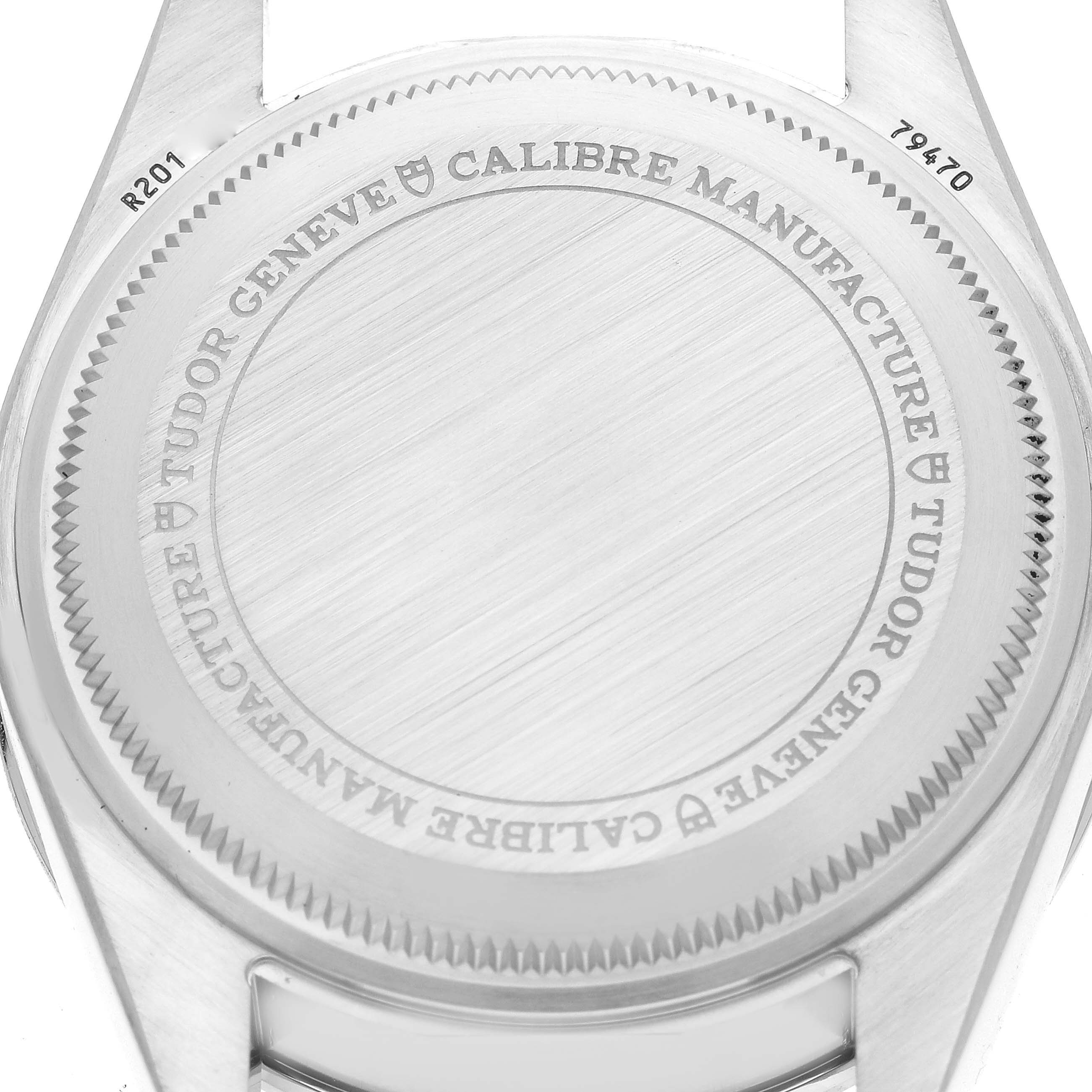 The image shows the back case of the Tudor Heritage Black Bay 79470 Men's Stainless Steel Black Dial 79470 Men's Stainless Steel Black Dial watch, with the brand and model details engraved.