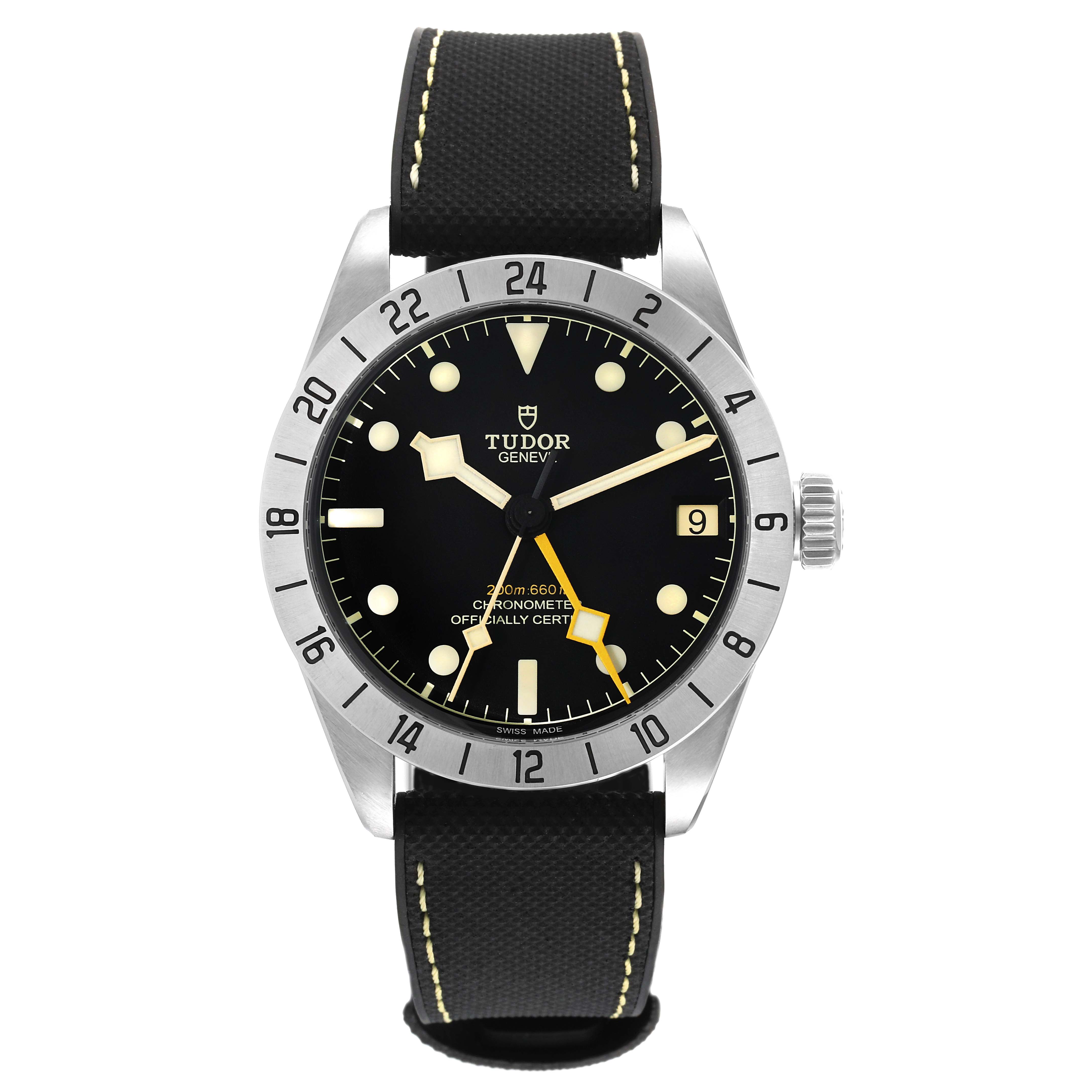 The image shows a front angle of the Tudor Heritage Black Bay 79470 Men's Stainless Steel Black Dial 79470 Men's Stainless Steel Black Dial watch, featuring its black dial, stainless steel case, and fabric strap.
