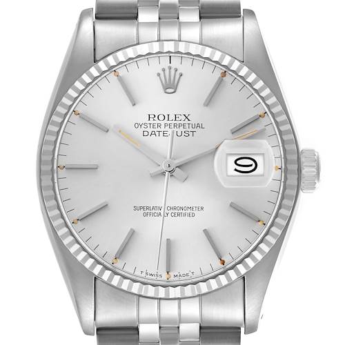 The Rolex Vintage Collection model 16014 is shown from a front angle, displaying the dial, fluted bezel, date, hands, and part of the bracelet.