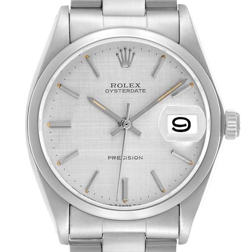 The image shows a frontal view of the Rolex Date model, model number 6694, highlighting the dial, hands, date window, and a portion of the bracelet.