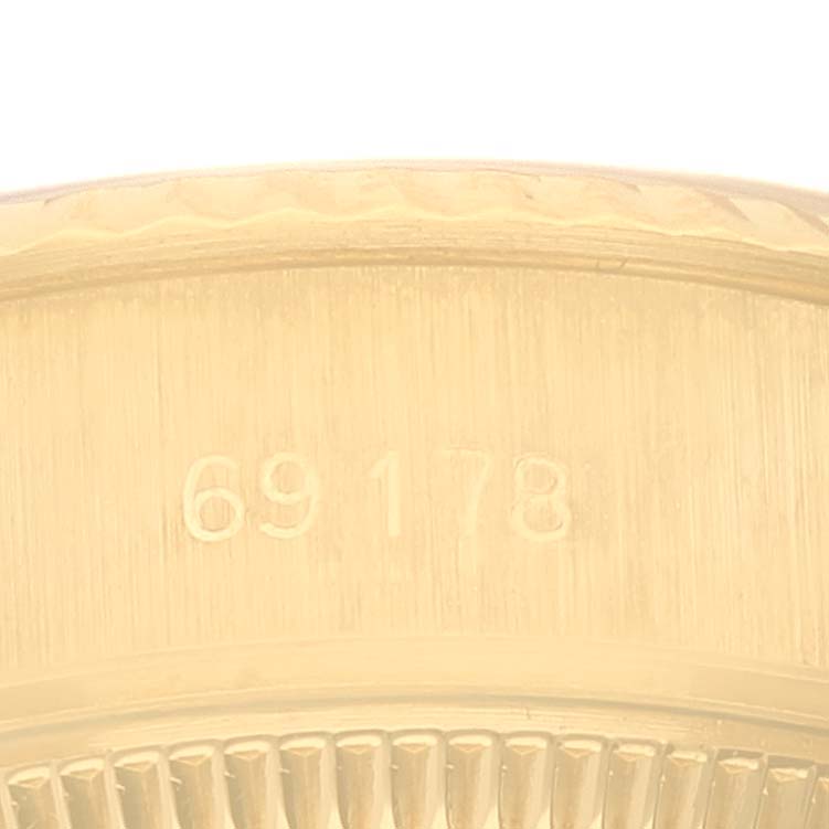 This image shows the serial number engraving on the side of a Rolex President 69178 Women's Yellow Gold Champagne Dial 69178 Women's Yellow Gold Champagne Dial model watch case.