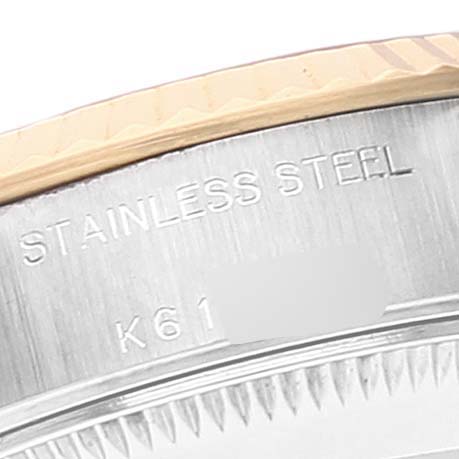 This image shows a partial view of the stainless steel case back of a Rolex Datejust 79173 Women's Steel and Gold (two tone) White Dial 79173 Women's Steel and Gold (two tone) White Dial watch.