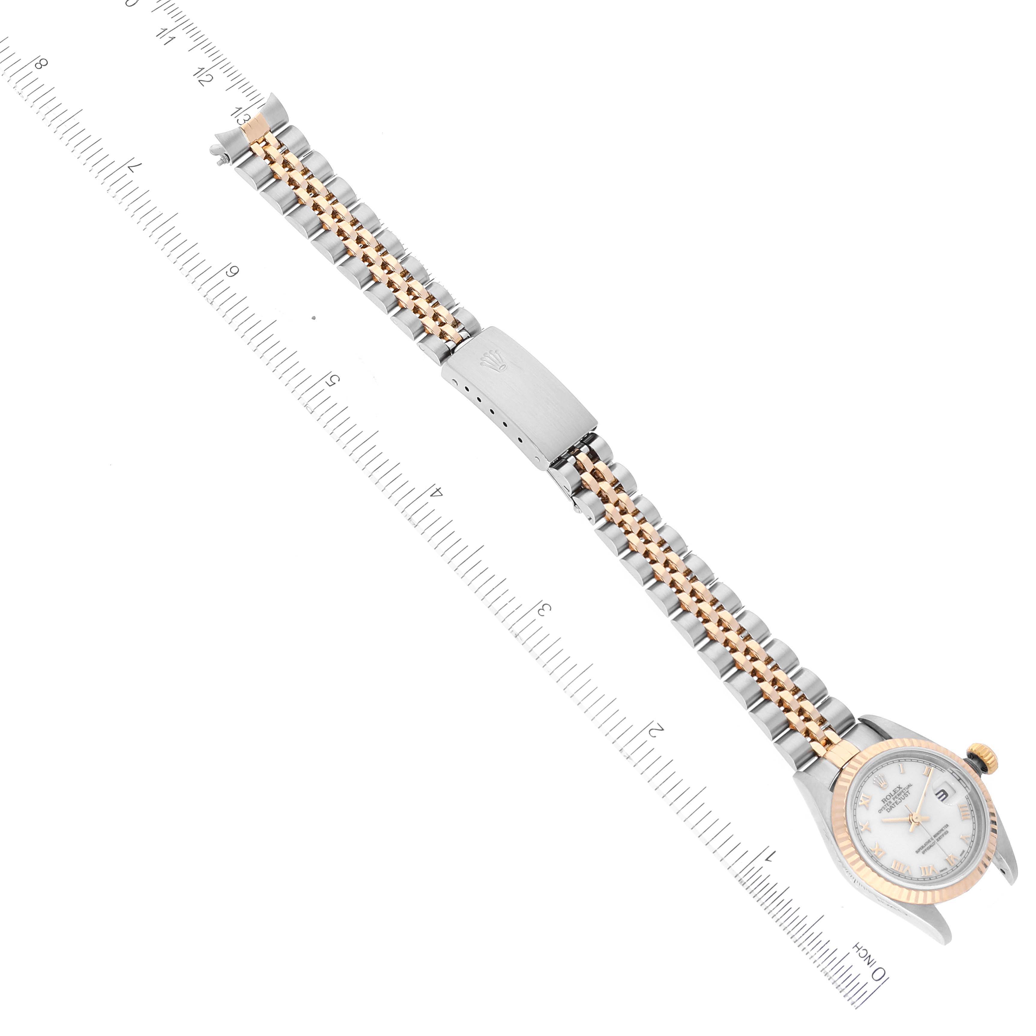 The image shows a top view of a Rolex Datejust 79173 Women's Steel and Gold (two tone) White Dial 79173 Women's Steel and Gold (two tone) White Dial model watch, including its two-tone bracelet and clasp.