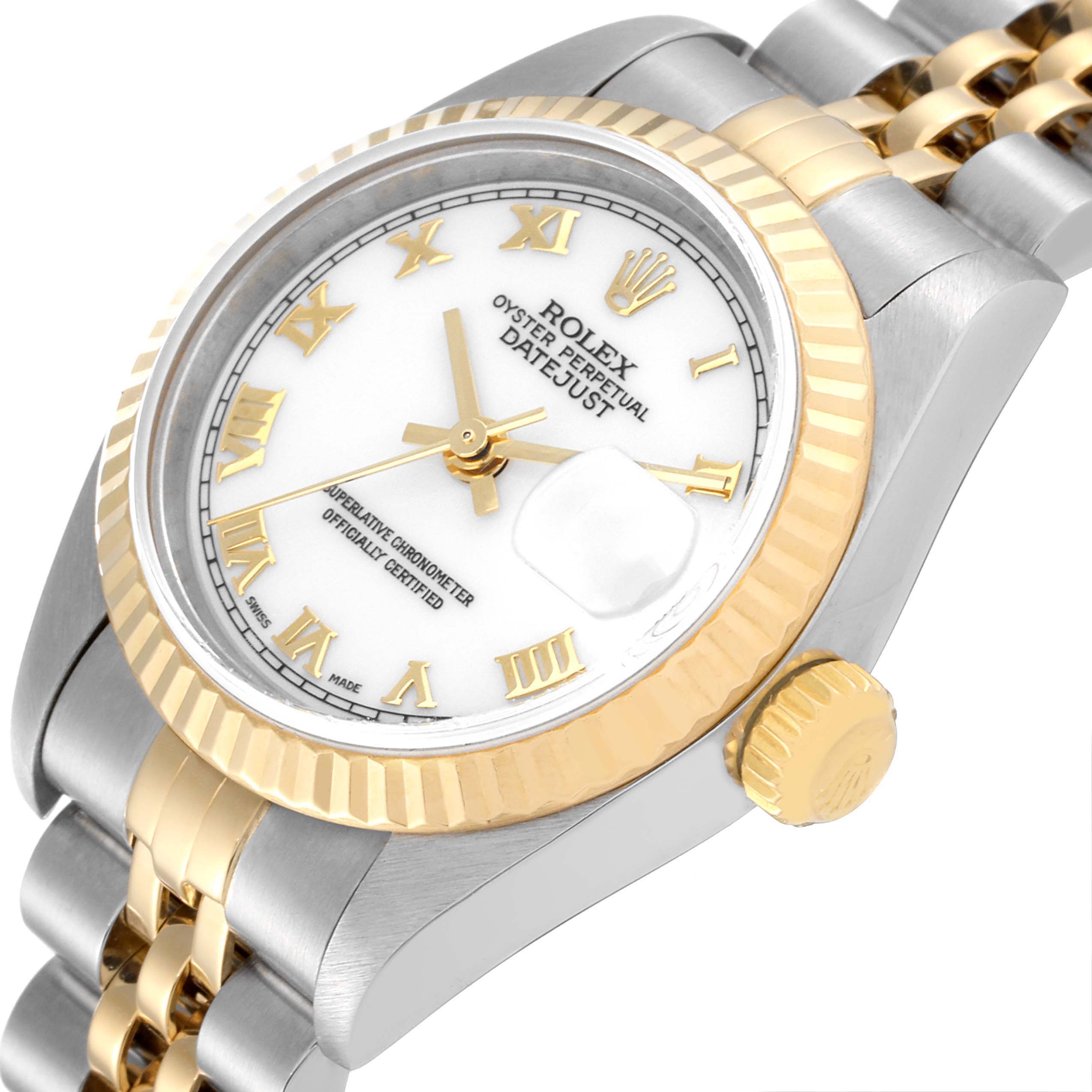 The image shows an angled view of a Rolex Datejust 79173 Women's Steel and Gold (two tone) White Dial 79173 Women's Steel and Gold (two tone) White Dial watch, highlighting the dial, fluted bezel, crown, and part of the jubilee bracelet.