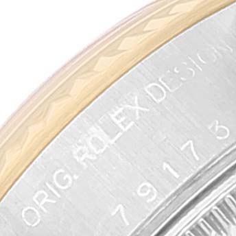 The image shows a partial view of the case back and edge of the bezel of a Rolex Datejust 79173 Women's Steel and Gold (two tone) White Dial 79173 Women's Steel and Gold (two tone) White Dial watch.