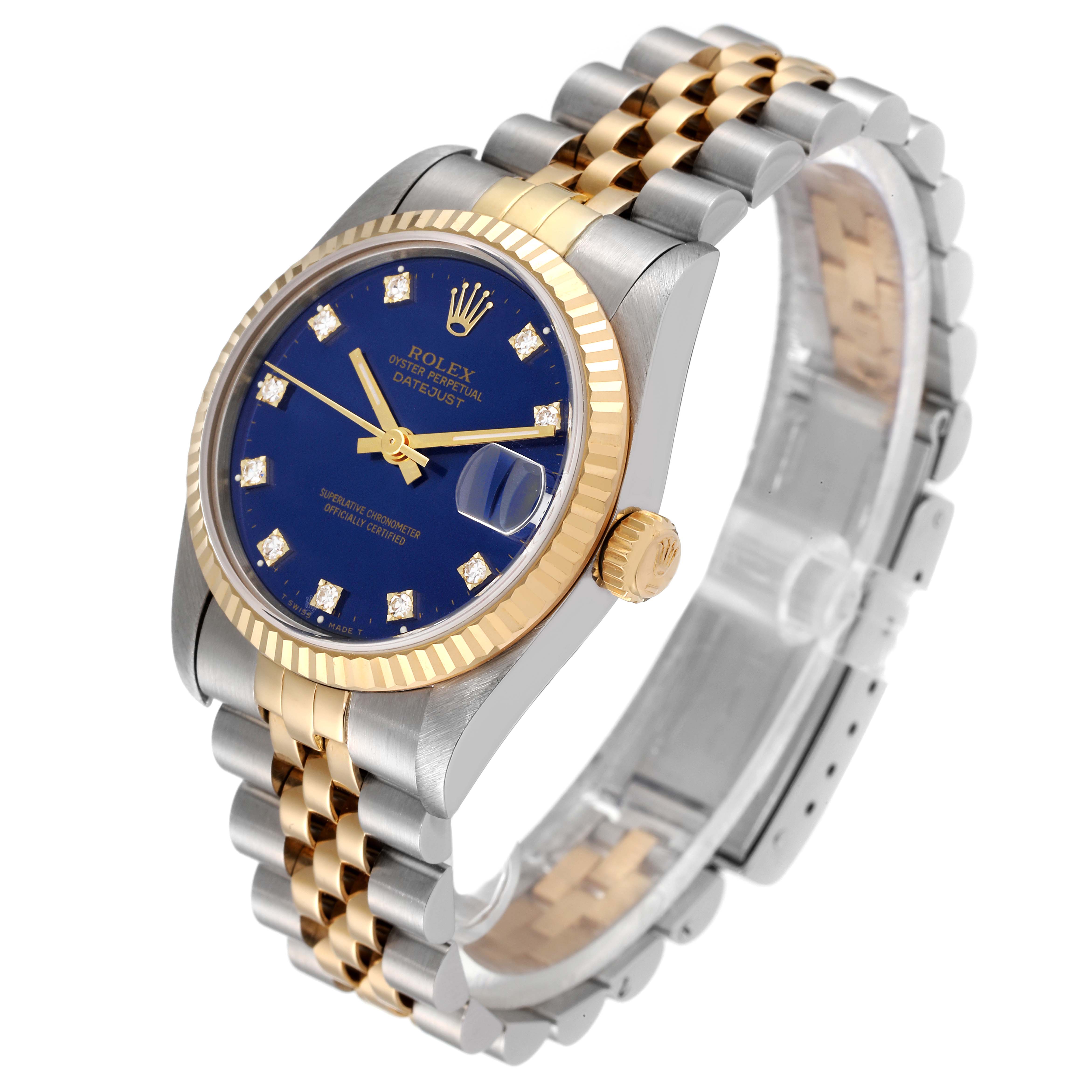 This Rolex Mid-Size 68273 Women's Steel and Gold (two tone) Blue Dial 68273 Women's Steel and Gold (two tone) Blue Dial model watch is shown at a slight angle, highlighting the blue dial, gold bezel, and two-tone bracelet.