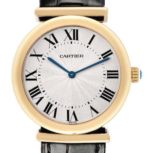 The Vendome model by Cartier is shown from the front, highlighting its round gold case, Roman numerals, and blue hands.