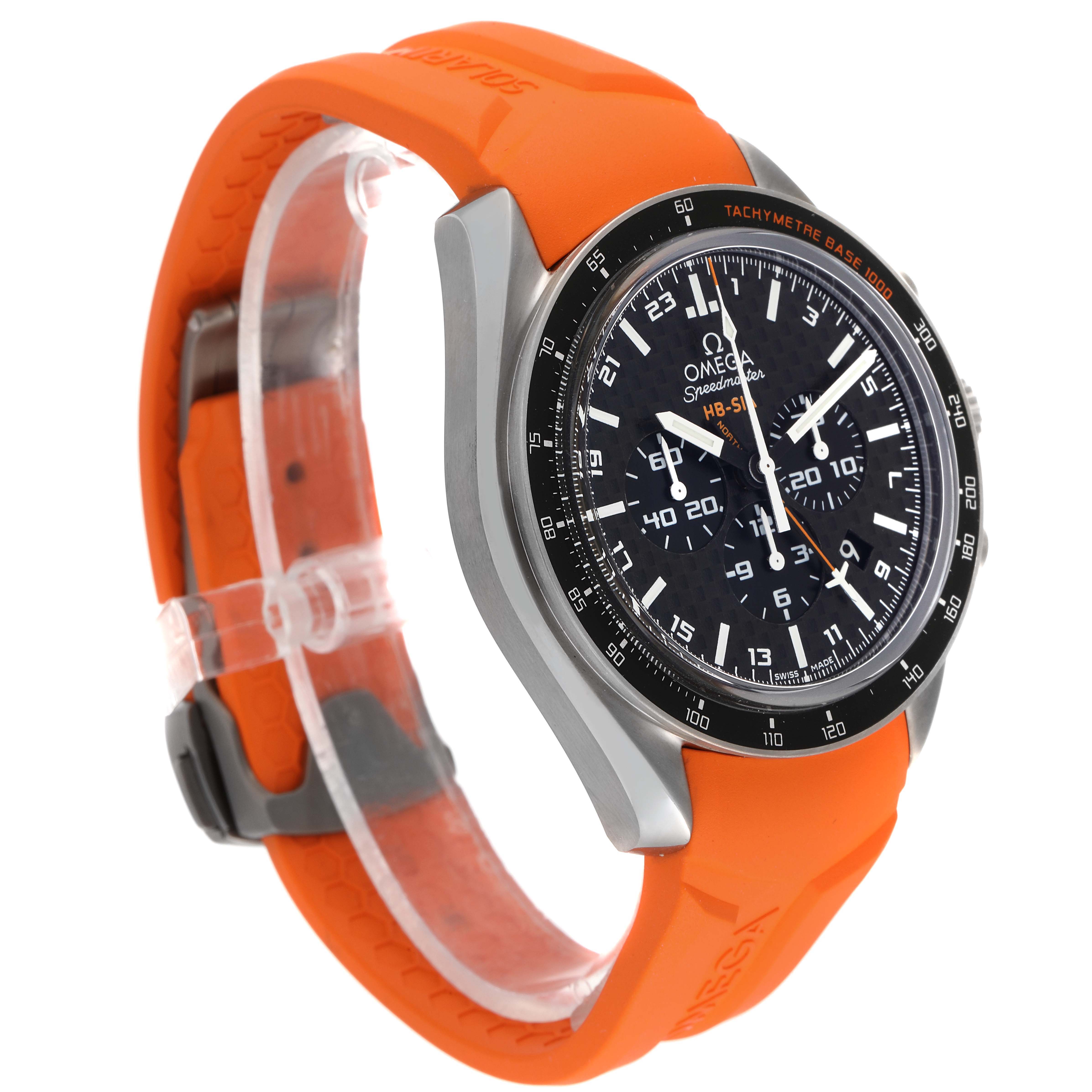 The Omega Speedmaster 321.92.44.52.01.003 Men's Titanium Black Dial 321.92.44.52.01.003 Men's Titanium Black Dial watch is shown at a 3/4 angle, highlighting the dial, bezel, and orange rubber strap.