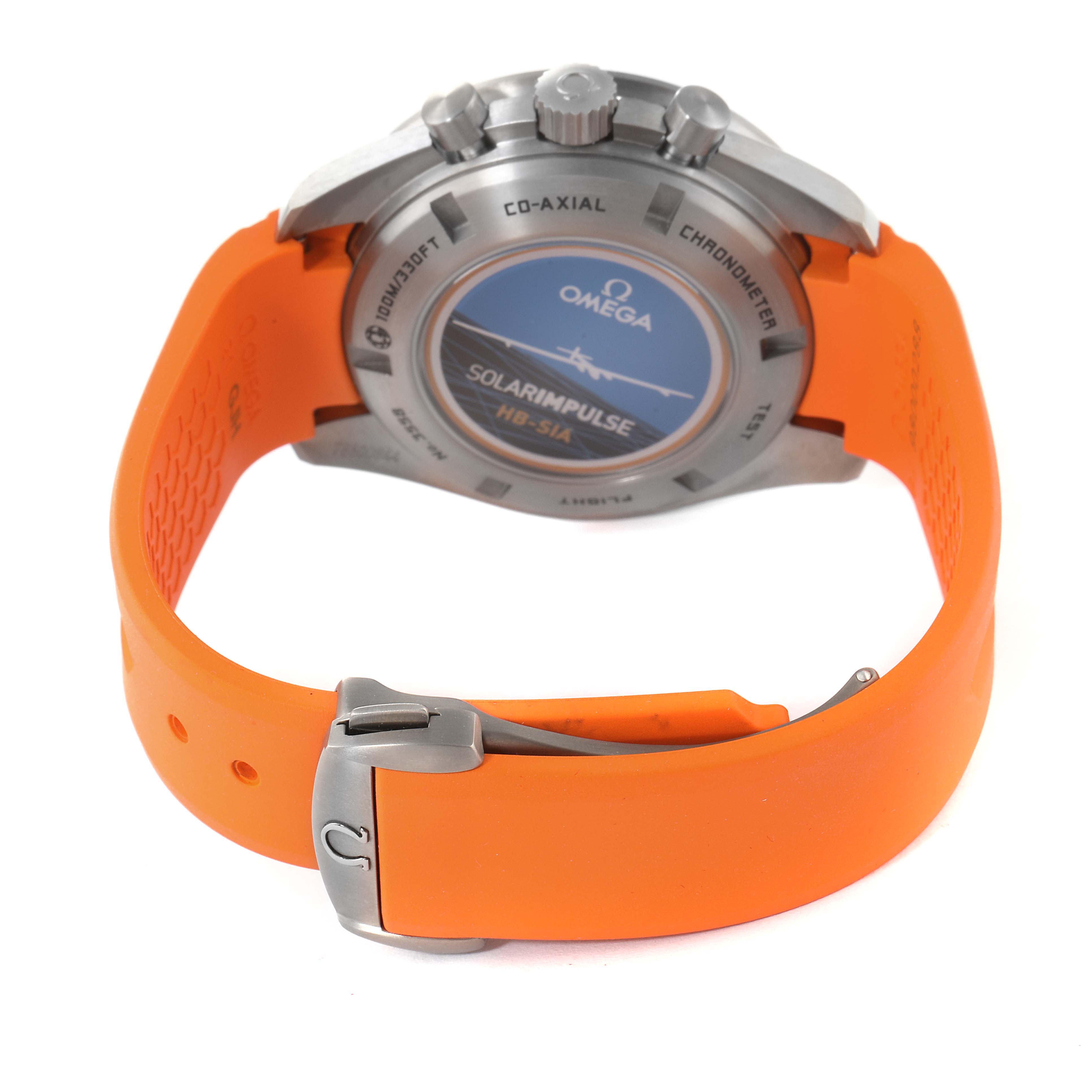 The image shows the back case and the orange strap with a clasp of an Omega Speedmaster 321.92.44.52.01.003 Men's Titanium Black Dial 321.92.44.52.01.003 Men's Titanium Black Dial watch viewed from the rear angle.