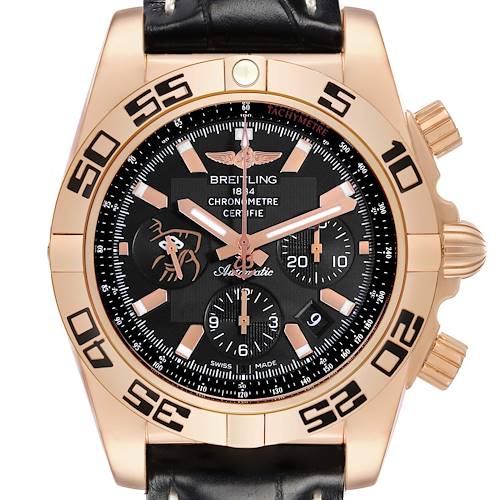 The Breitling Chronomat HB01115W/BE53 Men's Rose Gold Black Dial HB01115W/BE53 Men's Rose Gold Black Dial watch is shown from the front, highlighting the dial, bezel, and crown, with a leather strap visible.