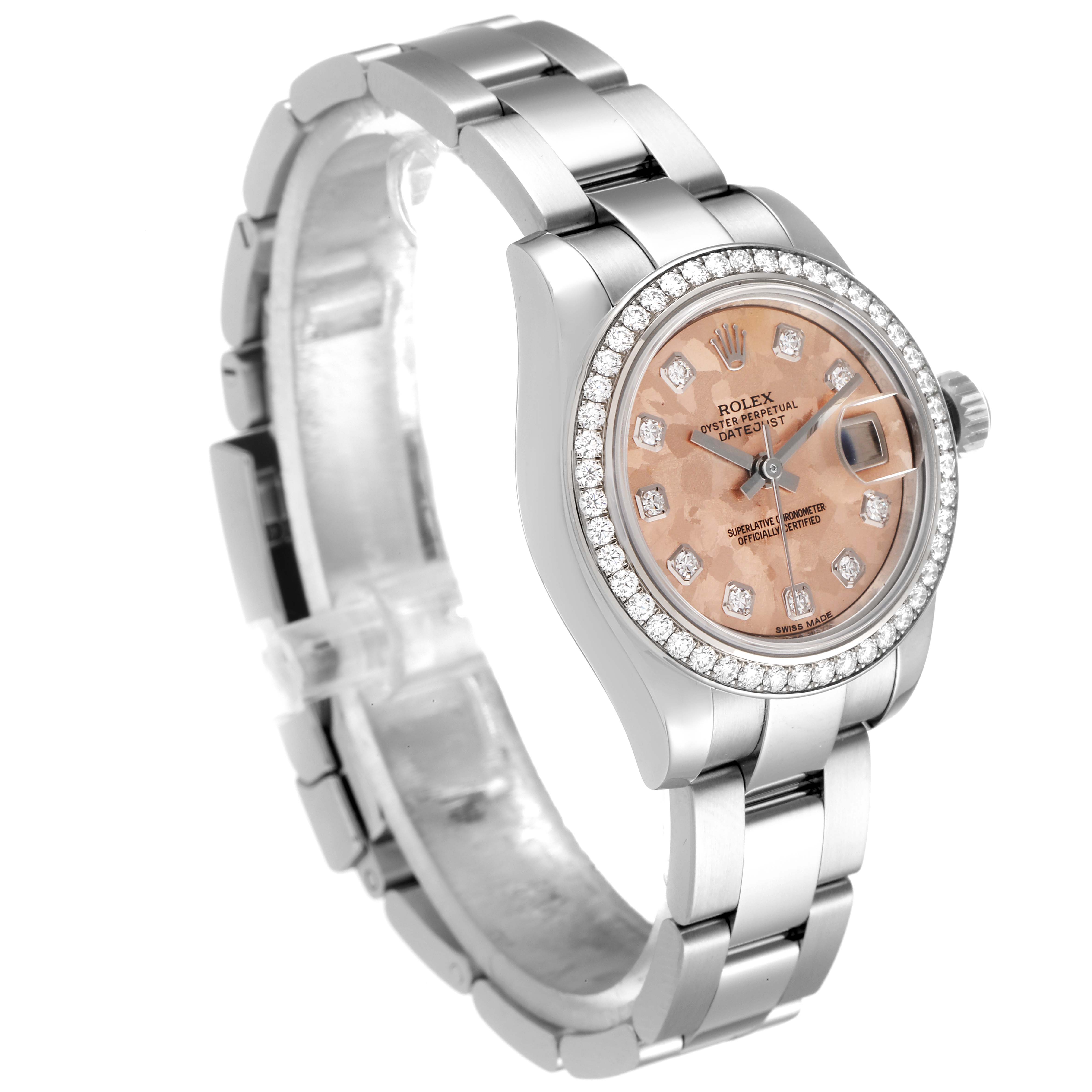 The Rolex Datejust 179384 Women's Stainless Steel Pink Dial 179384 Women's Stainless Steel Pink Dial watch is shown at a three-quarter angle, displaying its bezel, dial, bracelet, and part of the clasp.