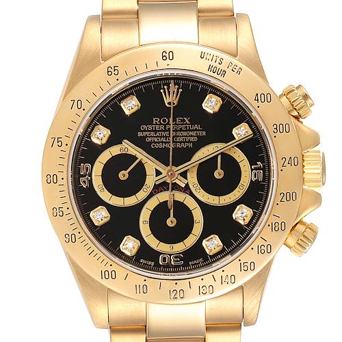 The image shows a frontal view of a Rolex Daytona 16528 Men's Yellow Gold Black Dial 16528 Men's Yellow Gold Black Dial watch featuring a black dial, three subdials, and a gold case.