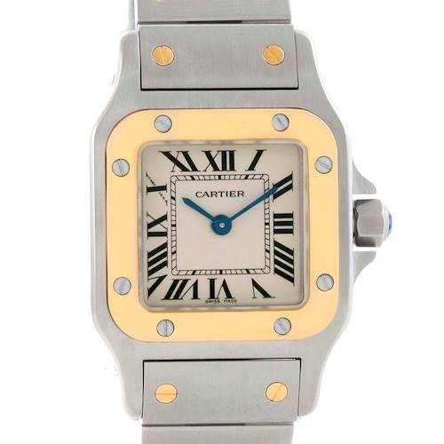 The image shows the front view of the Cartier Santos W20012C4 Women's Stainless Steel Silver Dial W20012C4 Women's Stainless Steel Silver Dial watch, highlighting its dial, bezel, and part of the bracelet.