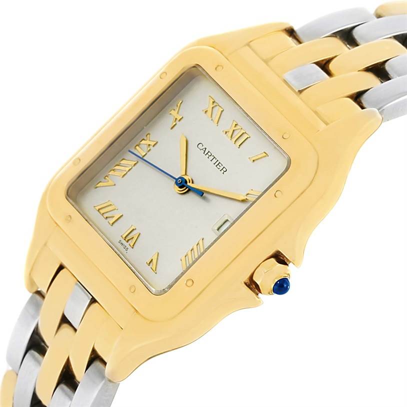 The angled view of this Cartier Panthere 887968C Yellow Gold Silver Dial 887968C Yellow Gold Silver Dial watch shows the face, Roman numeral markers, part of the bracelet, and the crown with a blue cabochon.