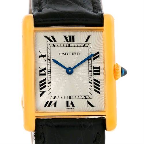 The image shows a front view of the Tank Classic model by Cartier, highlighting the dial, Roman numerals, and leather strap.