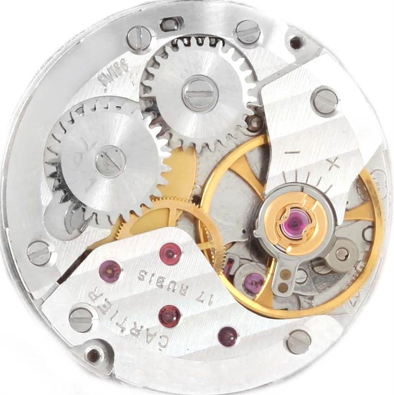 The image shows the intricate internal mechanism of a Cartier Tank Classic Men's Yellow Gold White Dial Men's Yellow Gold White Dial watch, viewed from the back.