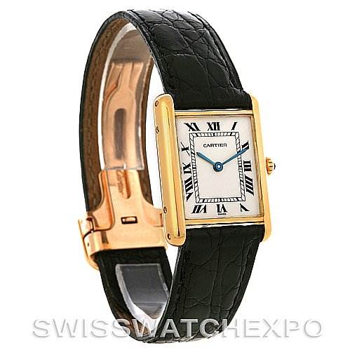 The image shows a Cartier Tank Classic Yellow Gold White Dial Yellow Gold White Dial watch from an angled side view, highlighting the rectangular face, black leather strap, and clasp.