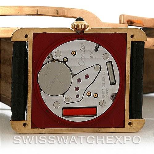 The image shows the back of the Cartier Tank Classic Yellow Gold White Dial Yellow Gold White Dial watch, exposing its internal mechanical parts. 