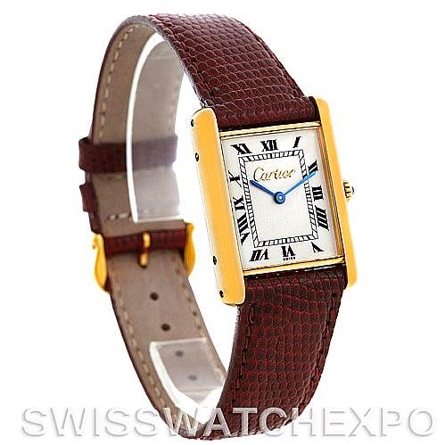 The image shows a Cartier Tank Classic Men's Yellow Gold Silver Dial Men's Yellow Gold Silver Dial watch at a slight angle, highlighting its rectangular face and brown leather strap.
