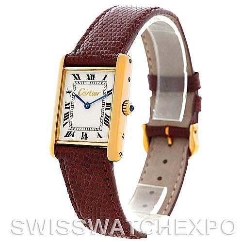 This image shows a Cartier Tank Classic Men's Yellow Gold Silver Dial Men's Yellow Gold Silver Dial watch at a side angle, highlighting the face, strap, and gold casing.