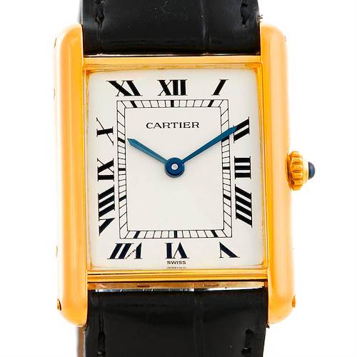 The image shows a front view of the Cartier Tank Classic Men's Yellow Gold Silver Dial Men's Yellow Gold Silver Dial watch, highlighting its rectangular dial, gold casing, and black leather strap.