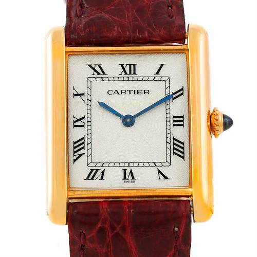 This image shows a close-up, front view of a Cartier Tank Classic 960655124 Men's Yellow Gold Silver Dial 960655124 Men's Yellow Gold Silver Dial watch, highlighting the face and part of the strap.