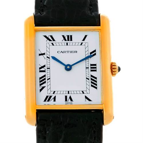 This is a frontal view of the Cartier Tank Classic Yellow Gold White Dial Yellow Gold White Dial watch, showing the dial, Roman numerals, blue hands, gold case, and black strap.