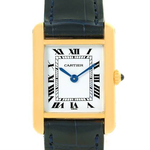 The image shows a front-angle view of the Cartier Tank Classic Women's Yellow Gold White Dial Women's Yellow Gold White Dial watch, highlighting its rectangular gold case, blue hands, and Roman numeral dial.