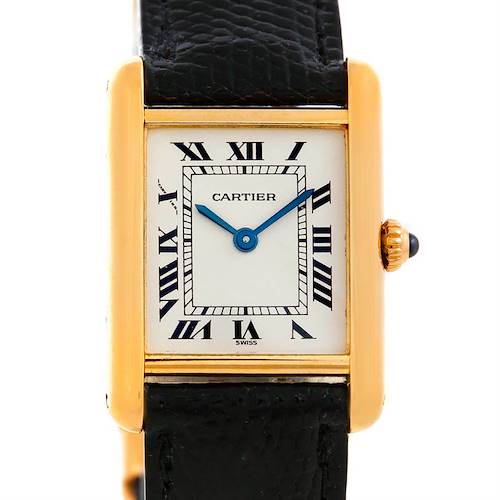 The image shows a Cartier Tank Classic Women's Yellow Gold Silver Dial Women's Yellow Gold Silver Dial watch in a close-up view, highlighting its face, case, crown, and part of the leather strap.
