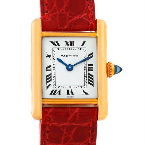 The Cartier Tank Classic Women's Yellow Gold White Dial Women's Yellow Gold White Dial watch is shown from a front angle, displaying its rectangular face, Roman numerals, and red leather strap.