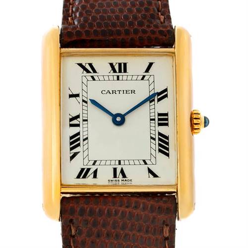 This image shows a front view of the Cartier Tank Classic Yellow Gold Beige Dial Yellow Gold Beige Dial watch, displaying its rectangular face, Roman numerals, and brown leather strap.