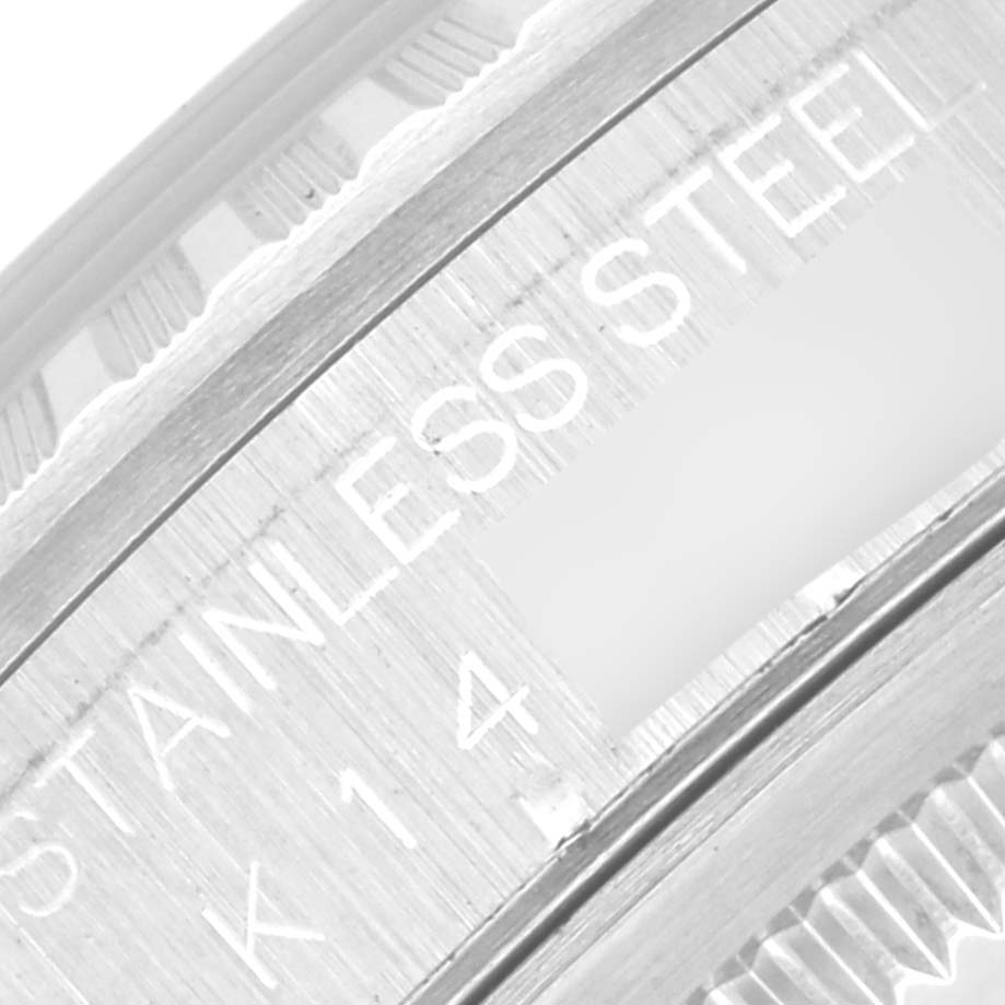 This close-up image of the Rolex Datejust 16220 Men's Stainless Steel Silver Dial 16220 Men's Stainless Steel Silver Dial showcases the side engraving on its stainless steel case.