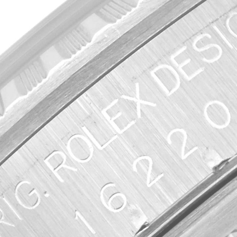 This image shows a close-up of the case and part of the bezel of a Rolex Datejust 16220 Men's Stainless Steel Silver Dial 16220 Men's Stainless Steel Silver Dial watch, highlighting the engraved text.