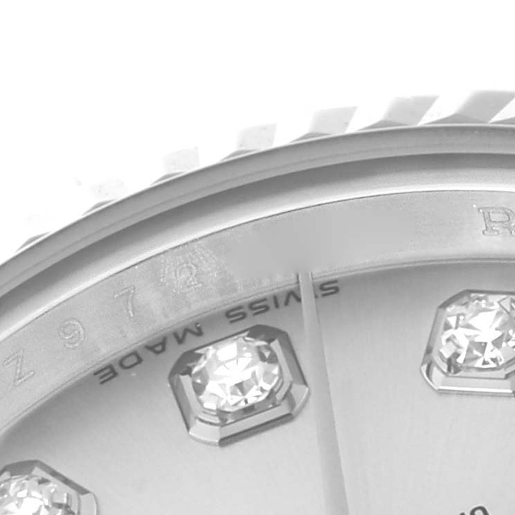 This close-up image shows part of the dial and diamond hour markers of a Rolex Datejust 179174 Women's Stainless Steel Silver Dial 179174 Women's Stainless Steel Silver Dial watch.