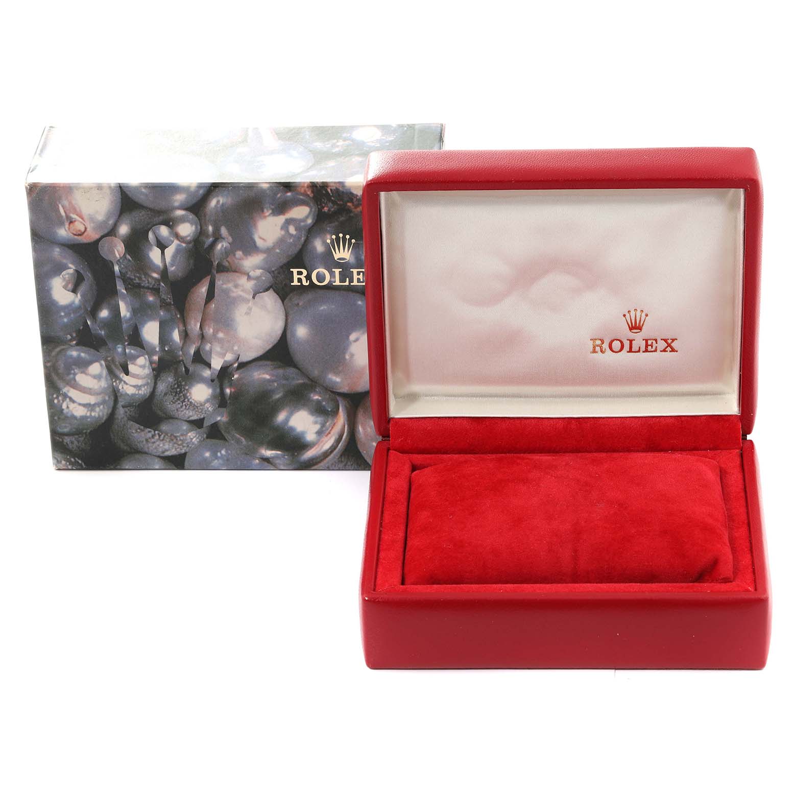 This image shows an open red Rolex box for the Datejust model, displaying the inner cushion and lining, along with its exterior packaging.