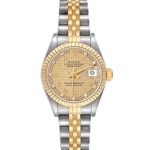 The Rolex Datejust model 69173 is shown from a top-down angle, displaying its gold and silver bracelet, fluted bezel, and diamond-set dial.