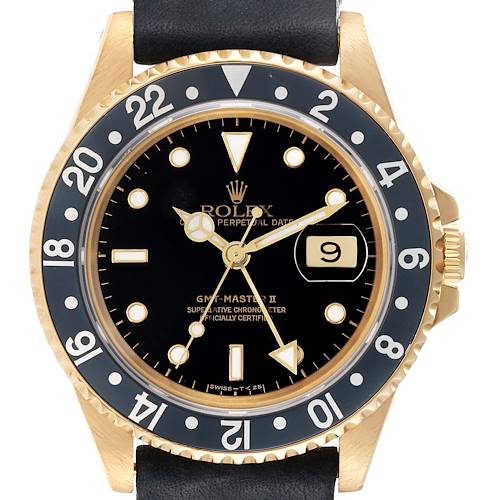The image shows the front dial and bezel of the Rolex GMT-Master 16718 Men's Yellow Gold Black Dial 16718 Men's Yellow Gold Black Dial II watch, highlighting its gold case, black dial, and numbered bezel.