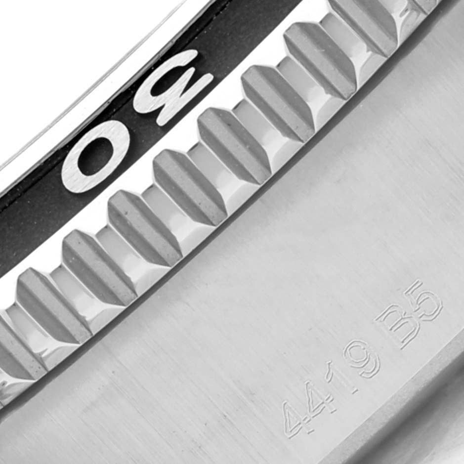 This image shows a close-up of the bezel area, particularly the 30-minute marker, of a Breitling Superocean A17366 Men's Stainless Steel Orange Dial A17366 Men's Stainless Steel Orange Dial watch.