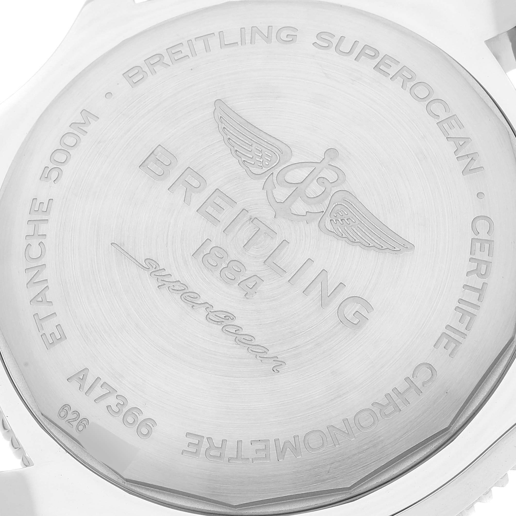 The image shows the back case of a Breitling Superocean A17366 Men's Stainless Steel Orange Dial A17366 Men's Stainless Steel Orange Dial watch, highlighting the engraved brand and model details.