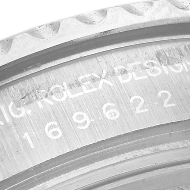 This is a close-up view of the Rolex Yacht-Master 169622 Women's Stainless Steel Silver Dial 169622 Women's Stainless Steel Silver Dial model's engraved bezel and serial number.