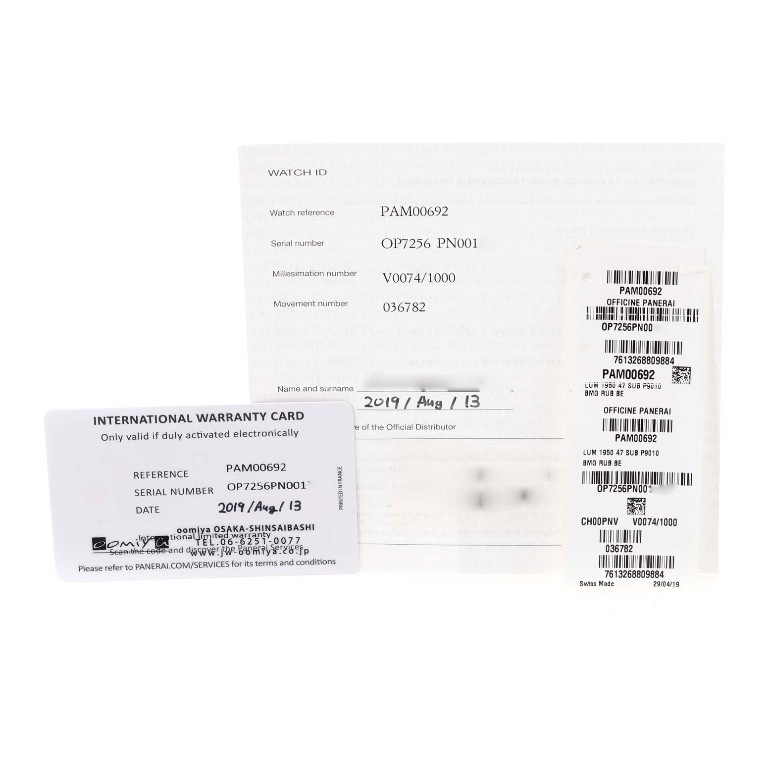 The image shows warranty cards and informational documents for a Panerai Submersible PAM00692 Men's Ceramic Blue Dial PAM00692 Men's Ceramic Blue Dial model watch.