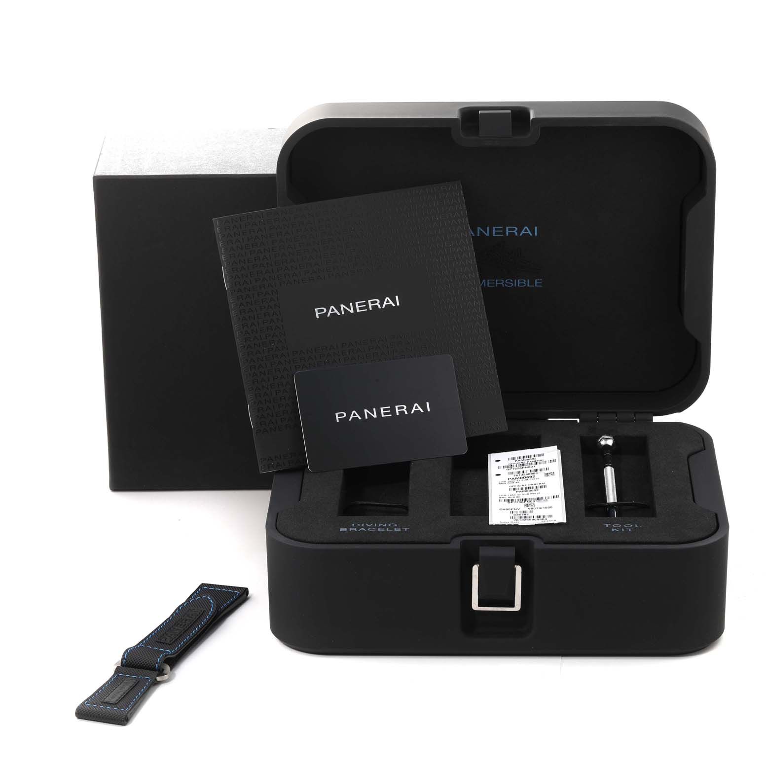 The image shows the Panerai Submersible PAM00692 Men's Ceramic Blue Dial PAM00692 Men's Ceramic Blue Dial watch's open case, additional strap, tools, and documentation from a top-front angle.