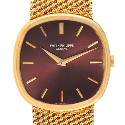 The image shows the face and part of the band of the Patek Philippe 3844 Men's Yellow Gold Brown Dial 3844 Men's Yellow Gold Brown Dial Ellipse 18k Yellow Gold Reddish Brown Dial Watch 3844 Papers model.
