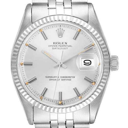 The Rolex Vintage Collection model 1601 watch is shown from a front angle, displaying its silver dial, date window, and fluted bezel.